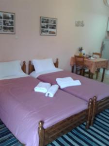 A bed or beds in a room at Zephyros