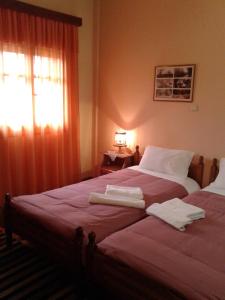 A bed or beds in a room at Zephyros