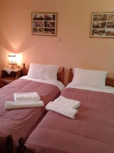 A bed or beds in a room at Zephyros