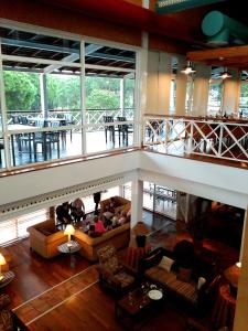 an overhead view of a living room with couches at Hotel Nuevo Portil Golf in El Rompido