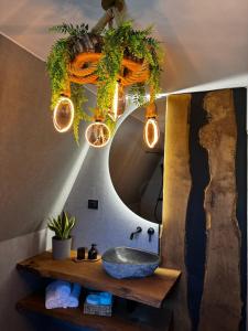 a bathroom with a sink and a mirror at A-Wine Villas in Novaci-Străini +31 photos