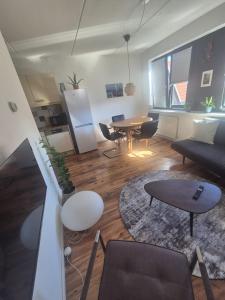 a living room with a couch and a table at O21 Apartment in Amersfoort