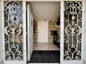 an entrance to a hallway with wrought iron gates at Timeout Apartment in Bad Arolsen +37 photos