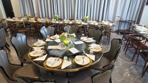 a large dining room with many tables and chairs at Tauese Seaview Hotel in Apia