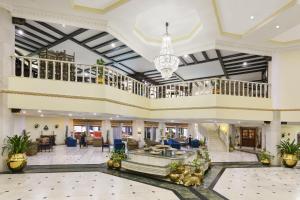 a lobby of a hotel with a chandelier at Ramada Khajuraho in Khajurāho +93 photos