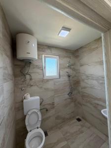 a bathroom with a toilet and a shower at stockholm in Bregvija +90 photos