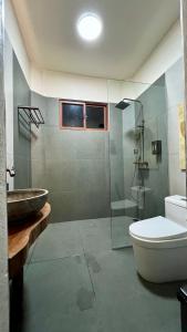 a bathroom with a glass shower and a toilet at Farm Village in San Juan +19 photos