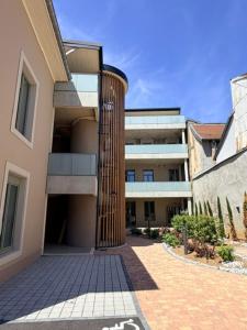 a large building with a column in front of it at Loft La Sous Préf! in Montbéliard +10 photos