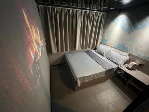 an overhead view of a small bed in a room at Where Inn in Hong Kong