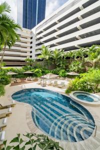 a swimming pool in the middle of a building at Hyatt Regency Panama City in Panama City