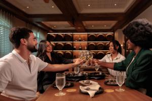 a group of people sitting around a table with wine glasses at Hyatt Regency Panama City in Panama City +113 photos