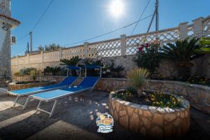 a playground with a blue slide in a yard at Casa Vacanza California in Bari