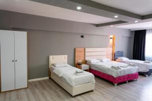 a hotel room with two beds at RİO's HOTEL KURTKÖY in Istanbul