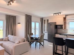 a living room with a couch and a table at Express Apartments Suceava in Ipoteşti