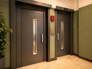 a row of elevator doors in a building at Centerstay Brussels in Brussels