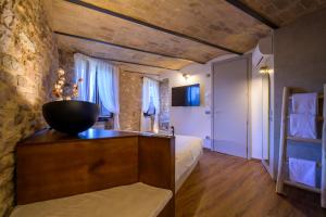a bedroom with a bed and a bowl on a table at Charme in Spello in Spello