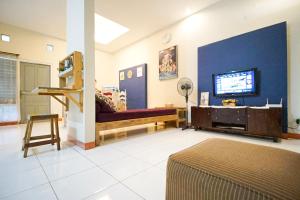 a living room with a couch and a tv at Citra Condong Catur in Seturan