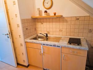 a small kitchen with a sink and a counter top at Willkommen bei Renate und Jörg in Unna +17 photos