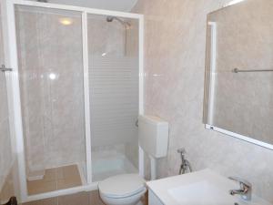 a bathroom with a shower and a toilet and a sink at Casa do Fundo do Povo - Serra da Estrela in Cortes do Meio