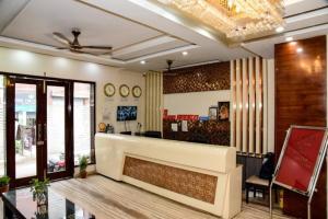 a lobby of a store with a reception counter at Hotel Grand In Near 2 Min From Vaishali Metro Station in Ghaziabad
