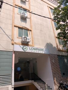 a building with a camera on the side of it at Lowfare Hotels Bengaluru in Bangalore