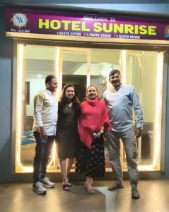 a group of people standing in front of a hotel sunrise at Hotel Sunrise, Panchgani in Panchgani