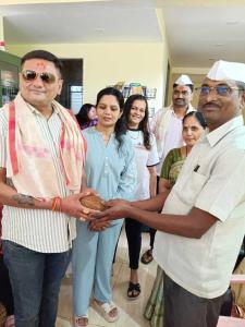 a group of people standing in a room at Hotel Sunrise, Panchgani in Panchgani