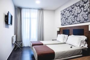 Ένα ή περισσότερα κρεβάτια σε δωμάτιο στο City Hotel Alger