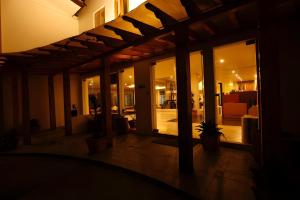 a house with a lit up patio at night at Resort Thim -Dorji Paro RiverFront in Paro