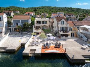 an aerial view of a house on the water at Dubravcevic Residence in Tivat