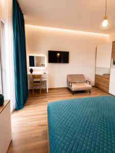 a living room with a bed and a couch at Sicily Luxury Apartments in Palermo