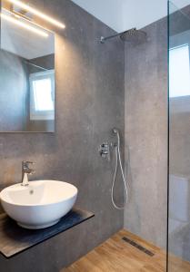 a bathroom with a sink and a shower at Cactus in Skiathos +25 photos