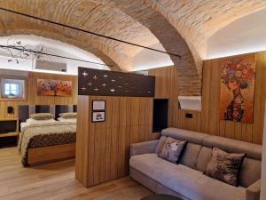 a living room with a couch and a bed at Suita beli Labod in Medvode +45 photos