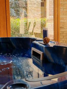 a pool of water with a sink in a room at Bes Hotel Bergamo Cologno al Serio in Cologno al Serio