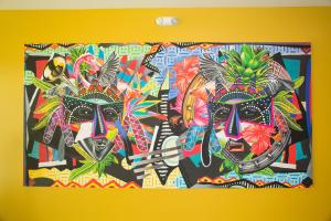 a painting of two masks on a wall at Warwick Paradise Island Bahamas - All Inclusive - Adults Only in Nassau