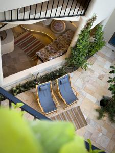 an overhead view of two chairs and a couch at Betham Chalet in Nizwa
