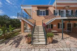 a house with stairs in front of it at Sivotahomes - Noah in Syvota