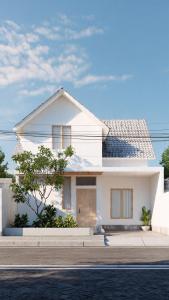 a white house on the side of a street at the ockta omeah 2 in Semenyih