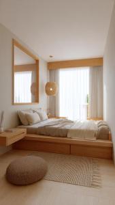 a bedroom with a large bed with a large window at the ockta omeah 2 in Semenyih