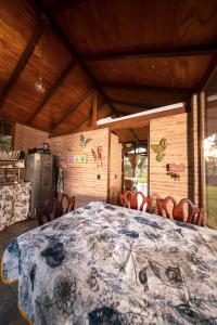 a room with a large bed in a house at Las Cabañas La Libertad in Macanal