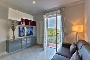 A television and/or entertainment centre at Versilia Residence