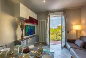 A television and/or entertainment centre at Versilia Residence