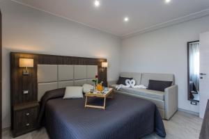 A bed or beds in a room at Versilia Residence