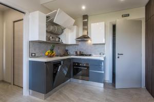 A kitchen or kitchenette at Versilia Residence