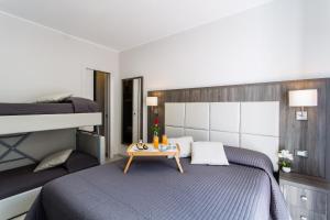 A bed or beds in a room at Versilia Residence