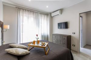 A television and/or entertainment centre at Versilia Residence