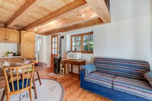 a living room with a couch and a table at Mille Colline la Casa 1 with Shared Pool - Happy Rentals in Pianezzo