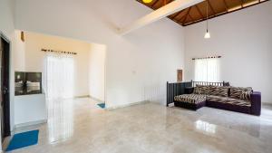 a large living room with a couch in the middle at Sigiriya River Side Villa in Sigiriya