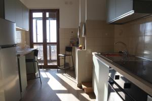 a kitchen with a sink and a counter top at Murazzanino in Murazzano