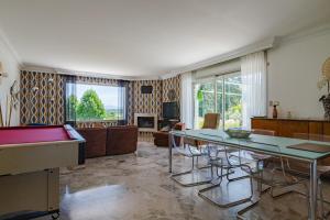 a living room with a ping pong table at Villa Montplaisir 180m² - Jacuzzi in Charmes-sur-Rhône